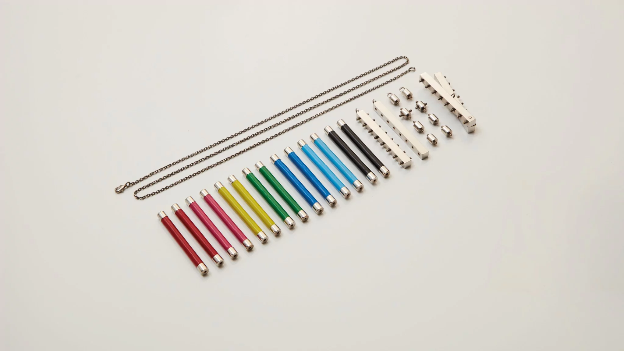 Rukpong and Goossens developed a kit of elements that is interchangeable. Brass palladium finish and decorated with colour enamel and different types of joint units that can be connected in various ways.